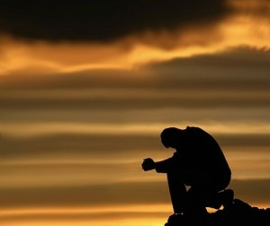 praying-kneeling-man-sunset